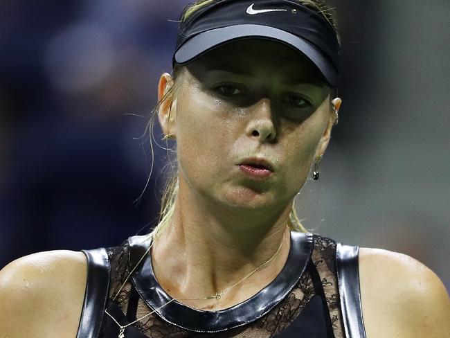 NEW YORK, NY - AUGUST 28:  Maria Sharapova of Russia reacts during her first round Women's Singles match against Simona Halep of Romania on Day One of the 2017 US Open at the USTA Billie Jean King National Tennis Center on August 28, 2017 in the Flushing neighborhood of the Queens borough of New York City.  (Photo by Elsa/Getty Images)