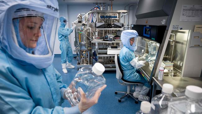 Employees test the procedures for the manufacturing of the messenger RNA (mRNA) for the Covid-19 vaccine at the new manufacturing site of German company BioNTech.