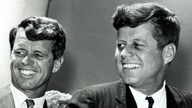 President John F, Kennedy, right, with his brother, then Attorney General, Robert Kennedy, shortly after JFK became the 35th President of the United States. JFK was assassinated while riding in a presidential motorcade in Dallas, Texas. Picture: Getty