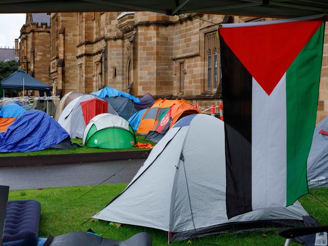 SYDNEY, AUSTRALIA - NewsWire Photos JUNE 15 2024. Scenes of pro-gaza & Palestine tent camp on the lawn of Sydney University. The uni has ordered the pro-Palestinian encampment to pack up and leave campus eight weeks after the tent protest appeared on its lawns. Picture: NewsWire / Max Mason-Hubers