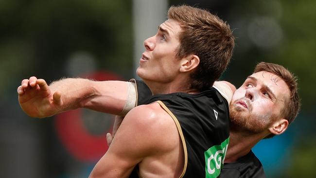 Mason Cox battles with Jordan Roughead at training. Picture: AFL Media