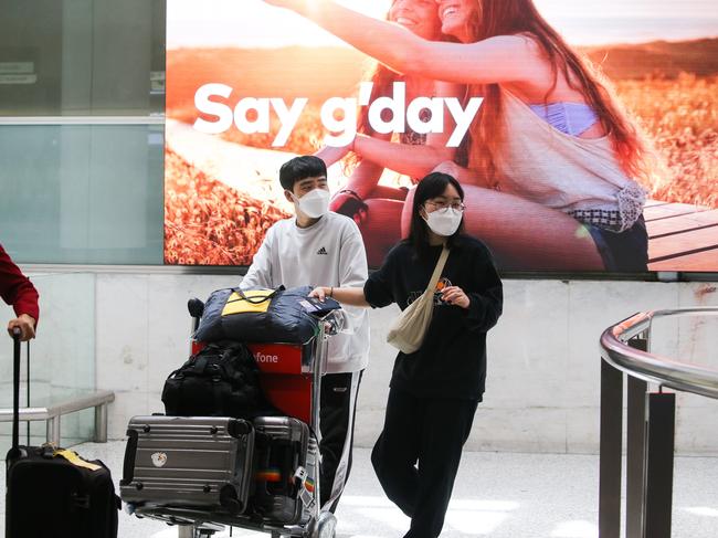 SYDNEY, AUSTRALIA - Newswire Photos JANUARY 02, 2022: People are seen arriving at the Sydney International Airport arrivals terminal, off a Cathay Pacific flight from Hong Kong after Australia set new Covid entry rules for travellers entering the country from China. The government is reportedly considering testing plane waste water on affected flights also. Picture: NCA Newswire / Gaye Gerard