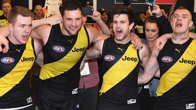 (From left) Jacob Townsend, Toby Nankervis, Trent Cotchin and Dustin Martin sing the song after Richmond’s preliminary final win.