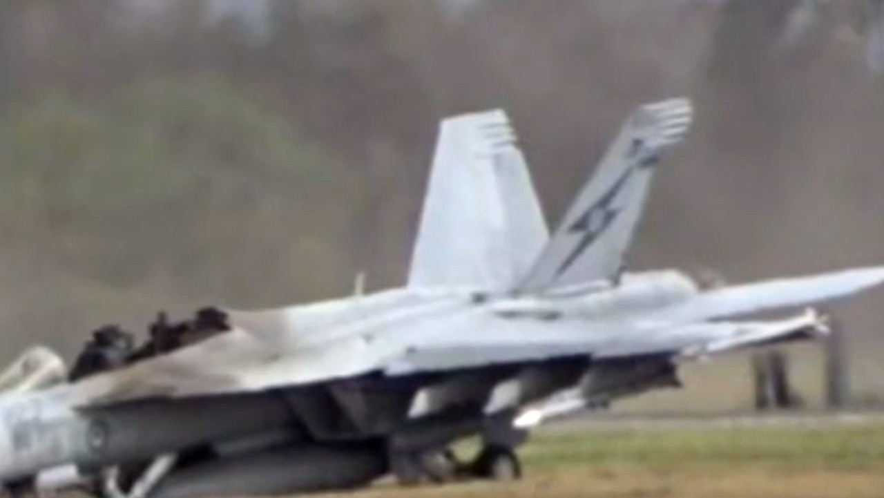 A damaged fighter jet on the ground at Amberley following an emergency incident. Picture: 9 News