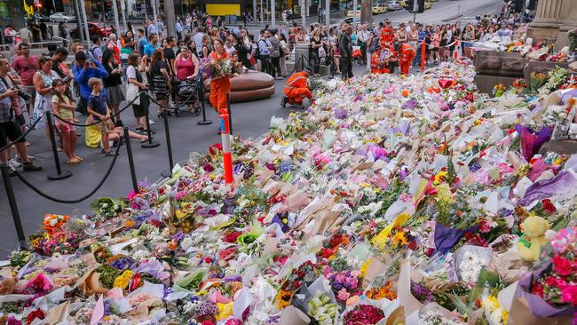 People pay their respects at Bourke St Mall. Picture: Getty