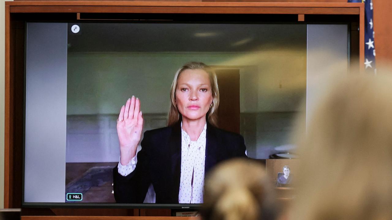 Model Kate Moss is sworn in via video link at the Fairfax County Circuit Courthouse in Fairfax, Virginia. (Photo by EVELYN HOCKSTEIN / POOL / AFP)