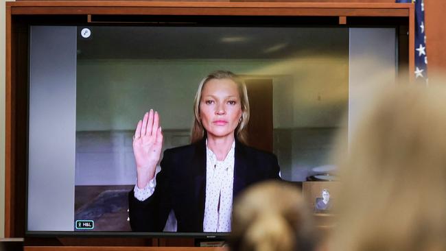 Model Kate Moss is sworn in via video link at the Fairfax County Circuit Courthouse in Fairfax, Virginia, on May 25. Picture: EVELYN HOCKSTEIN / AFP