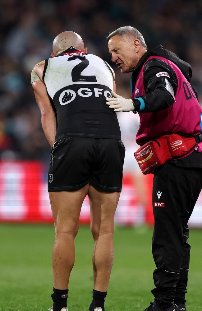 Fisher with Sam Powell-Pepper in 2023. Picture: Sarah Reed/AFL Photos via Getty Images.