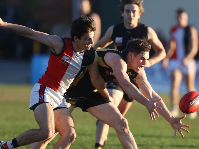 Liam Frazer stretches for the ball. Picture: Stuart Milligan