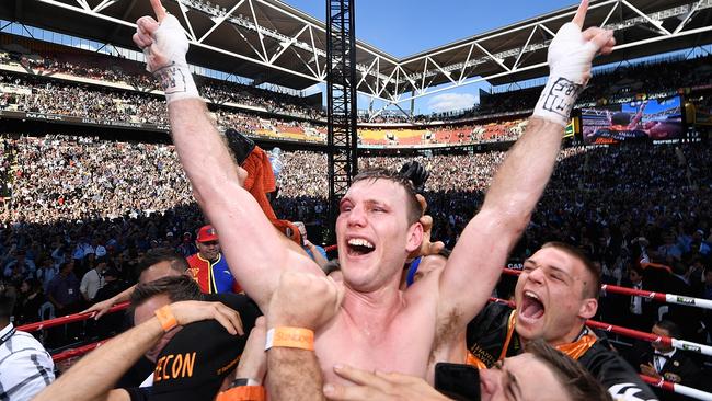 Top of the mountain. Jeff Horn celebrates his victory over Manny Pacquiao at a packed Suncorp Stadium in July 2017. Picture: Bradley Kanaris/Getty Images