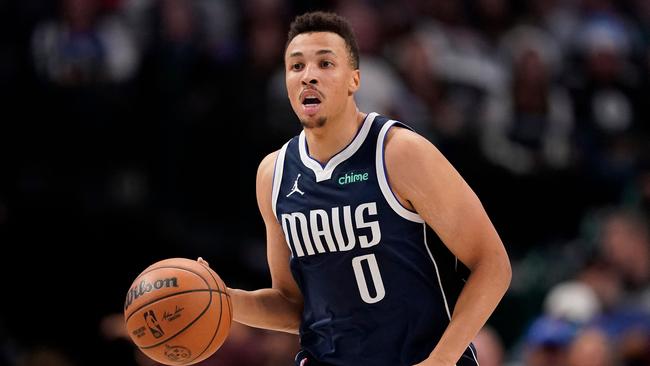 DALLAS, TEXAS - DECEMBER 23: Dante Exum #0 of the Dallas Mavericks brings the ball up court during the second half against the San Antonio Spurs at American Airlines Center on December 23, 2023 in Dallas, Texas. NOTE TO USER: User expressly acknowledges and agrees that, by downloading and or using this photograph, User is consenting to the terms and conditions of the Getty Images License Agreement.   Sam Hodde/Getty Images/AFP (Photo by Sam Hodde / GETTY IMAGES NORTH AMERICA / Getty Images via AFP)