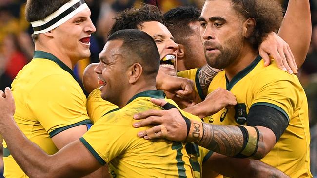 Kurtley Beale of the Wallabies (centre) celebrates with team mates after scoring a try during the Bledisloe Cup match between the Australian Wallabies and the New Zealand All Blacks at Optus Stadium in Perth, Saturday, August 10, 2019.  (AAP Image/Dave Hunt) NO ARCHIVING, EDITORIAL USE ONLY